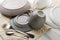 Closeup of clean wet dishes, cutlery on the towel, kitchen table