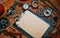 Closeup clipboard with vintage paper in the center of rusty tools, gears on metal background. Motorcycle tools, equipment and