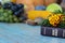 Closeup of a closed Holy Bible Book with flowers and fresh autumn Thanksgiving food in the background