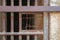 Closeup of a closed rusted iron bars of cell door in closed abandoned prison