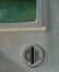 Closeup of coin slot of old public telephone