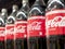 Closeup of Coke Light soft drinks on display at an aisle in a supermarket