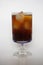 Closeup of Cola, black coffee, on champagne glass