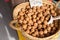 Closeup of collecting walnuts in a wicker handmade basket for sale