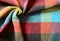 Closeup of colorful checkered plaid with drapery