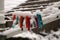 Closeup of colorful plastic clothespin covered with snow on a clothesline