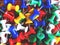 Closeup of colorful thumbtack pinned pile