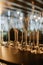 Closeup of colorful wine glasses.Wine glasses on a glass shelf with lighting. Empty crystal glasses close-up