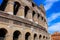 Closeup Colosseum in Rome with clouds in background, Italy.