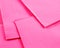 A closeup of colourful paper napkins in bright pink.