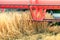 Closeup Combine harvesting a wheat field. Combine working