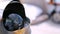 Closeup of a compass and deck of a wooden antique Sail boat navigating in the ocean sunny day showing the wooden parts and