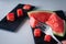 Closeup of a composition of fresh fruit of the summer, watermelon on white background with slate. Mediterranean diet with varied