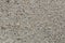 Closeup on concrete, small pebbles, background
