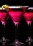 Closeup cosmopolitan cocktails isolated on black