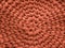 Closeup cotton  brown knit blanket, warm and comfortable atmosphere. Knit background