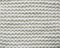 Closeup cotton white knit blanket, warm and comfortable atmosphere. Knit background.