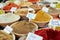 Closeup of a counter with a big variety of spices on Jerusalem market in Israel.