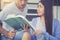 Closeup couple asian handsome man and beautiful woman reading book and glad at home