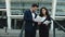 Closeup couple standing with papers. Couple analyzing documents outside