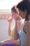 closeup of couple of women on yoga class exercises breathing technique healthy lifestyle concept