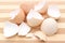 Closeup of cracked eggshell on wooden background