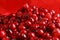 Closeup of cranberries on a red background