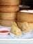 Closeup crispy deep fried taro dumpling in white plate with sweet sauce in dim sum set, Chinese restaurant food