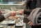 Closeup and crop of customer hands buy food in the market