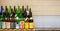 Closeup and crop decorate and opened Japanese whisky bottles and liquor bottle on wooden shelves