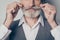 Closeup cropped photo of aged business man touch perfect groomed bristle mustache after salon styling wear white shirt