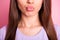 Closeup cropped photo of beautiful woman sending air kiss with pouted plump lips isolated on pastel pink color