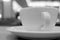 Closeup a cup of coffee on table in monotone