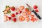 Closeup of Cut and Whole Strawberries on Cutting Board with Knife