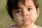 Closeup of cute adorable beautiful face of mixed race baby with
