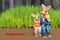 Closeup of cute rabbit figurines with grass in the background and text that reads HAPPY EASTER