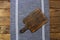 Closeup cutting board tablecloth. wooden background. Linen table cloth on brown wood textured tabletop. Mock up, copy space.