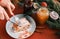 Closeup cutting eating strudel on a Christmas plate near jam jars. Christmas breakfast. Red table