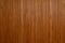 Closeup of dark brown and yellow natural wooden texture with vertical stripes