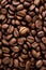 Closeup of dark coffee arabica beans texture. Caffeine aroma. Heap of scented black grains