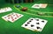 Closeup of dealt cards and stacks of chips on a Blackjack table in a casino