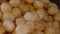 Closeup of deep-fried dough balls in a food stall