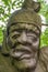 Closeup of deformed face on stone statue at religious Ghost City, Fengdu, China