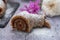 Closeup of delicious-looking sliced raw vegan roll on a purple tabletop