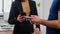 Closeup of delivery man holding takeaway food order meal bringing at company office