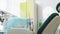 Closeup of a dental clinic office in soothing green tones. Modern equipment and interior. Background for the commercial