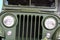 Closeup detail of front mask of american off road vehicle Jeep CJ-6, known under military version name M170, introduced in 1953.