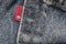 Closeup detail of levi`s red tag on levi `s jeans.