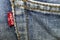 closeup detail of levi `s red tag on levi `s jeans.