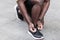 Closeup detail. Man ties up the shoelaces on sneakers before run